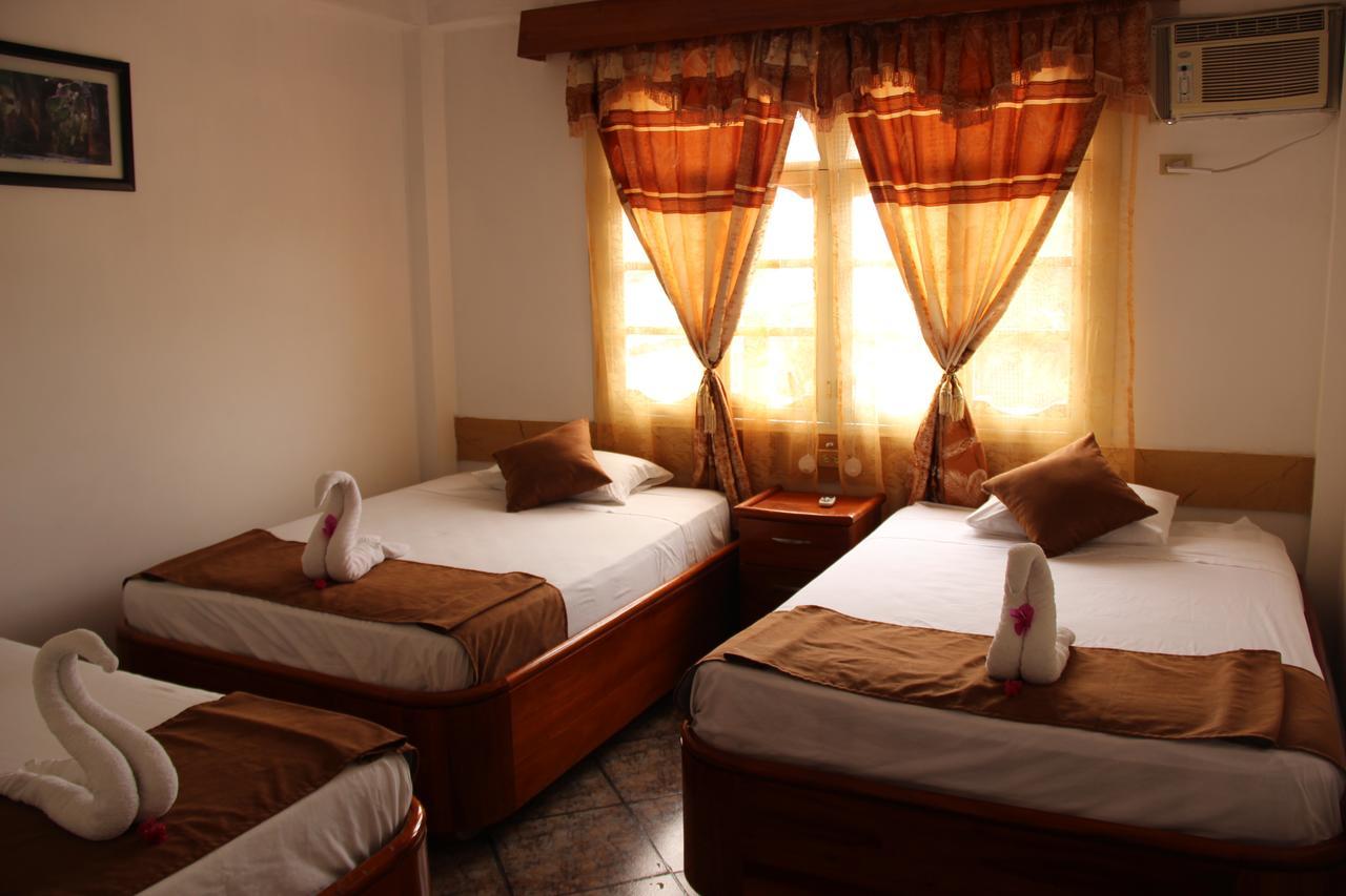 Hotel Crossman ปูแอร์โตอาโยรา ภายนอก รูปภาพ