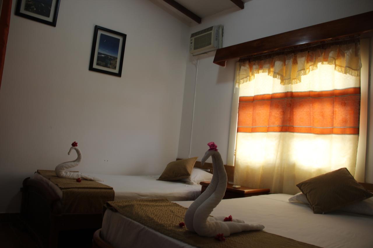 Hotel Crossman ปูแอร์โตอาโยรา ภายนอก รูปภาพ